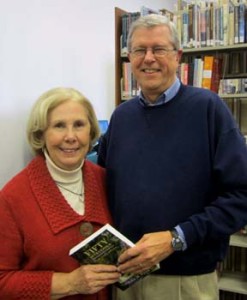 John Floyd and a fan hold his newest book