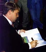 Mark Childress signing books at the Eudora Welty Symposium, 1996, photo by Nancy Jacobs