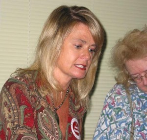 Marlo Kirkpatrick signs her book.  Photo by Nancy Jacobs