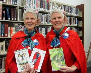 Katherine and Margaret King hold copies of their books at Starkville Public Library in 2014.