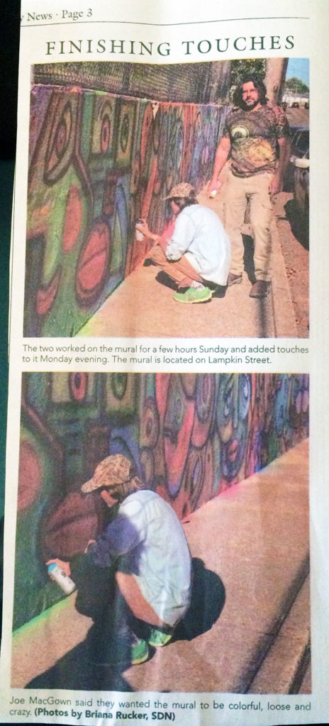 Photos of Joe and Joseph MacGown painting a wall mural from the Starkville Daily News